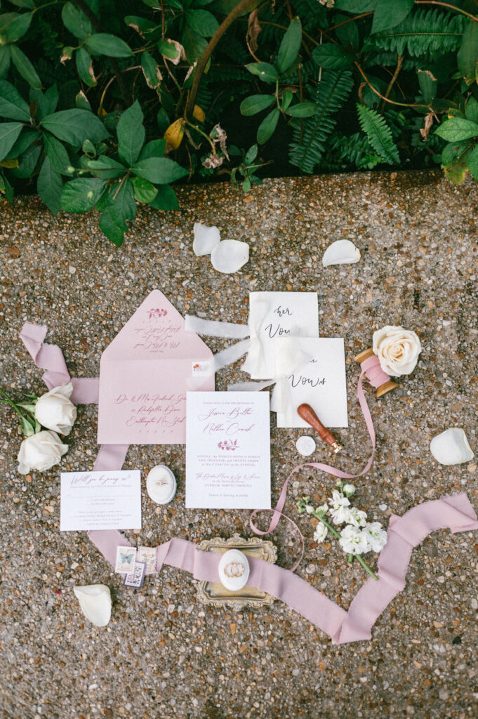 Flay lay of wedding invitation suite