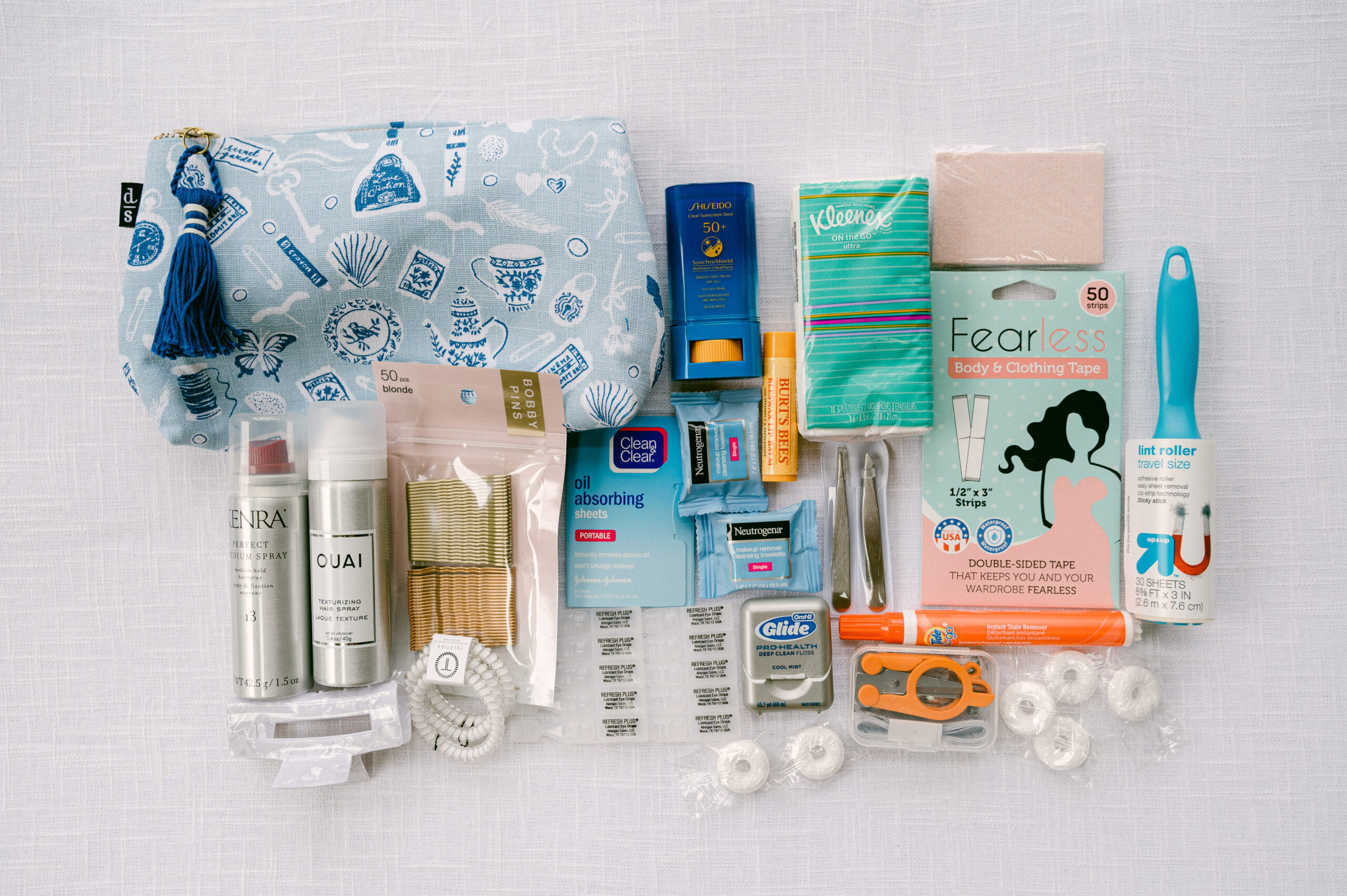 Flat lay image of wedding day emergency kit must have items