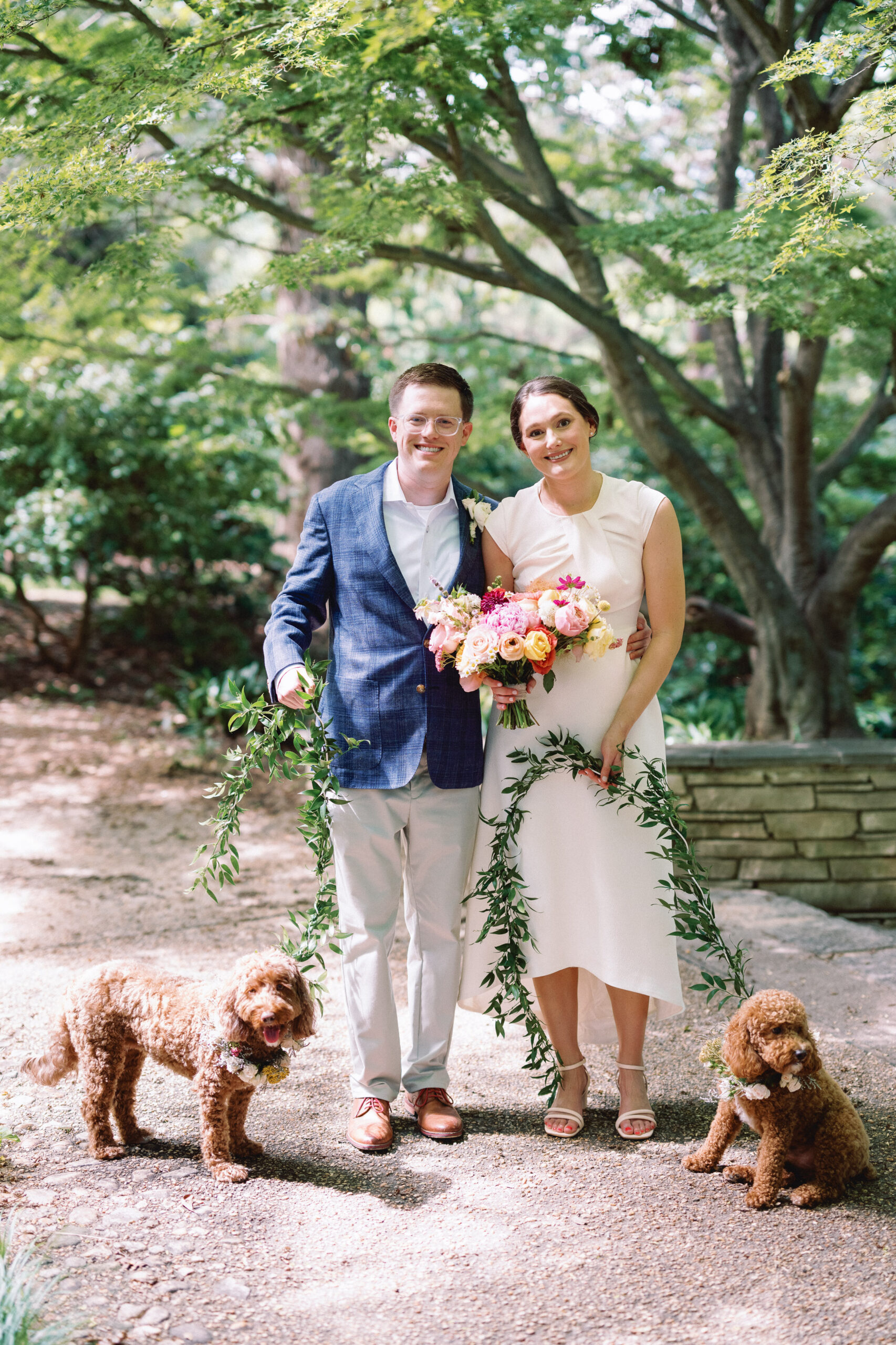 Raleigh wedding bride and groom portrait with summer wedding flower bouquet and dogs