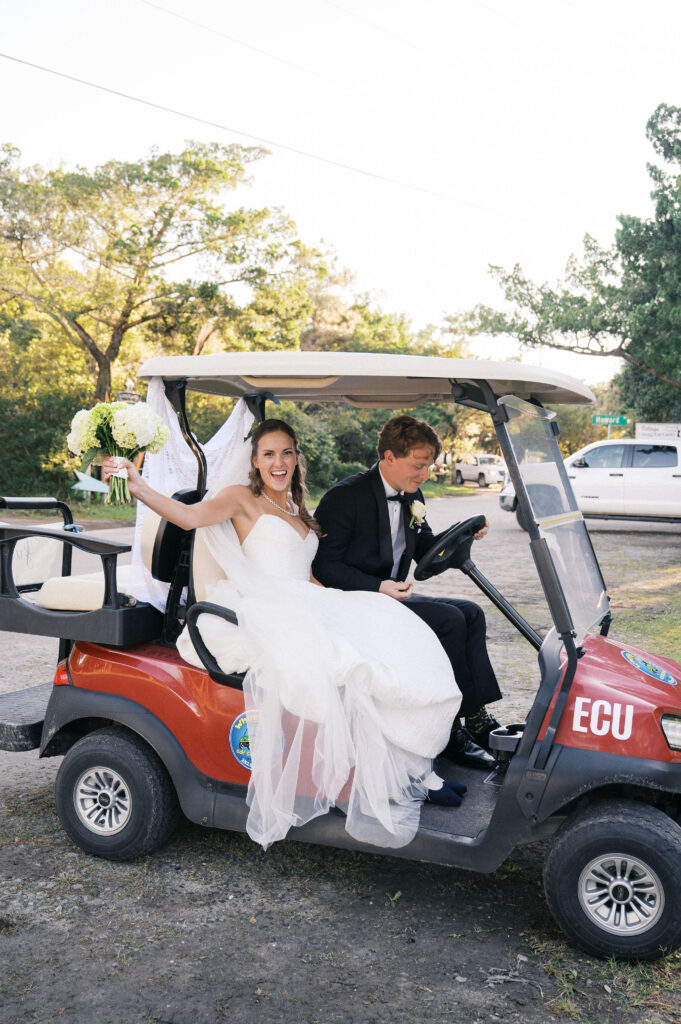 bride and groom in a golf cart