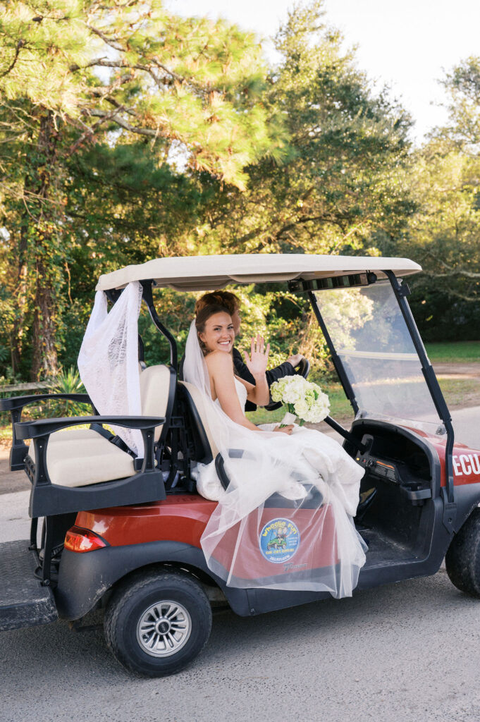 bride and groom in a golf cart