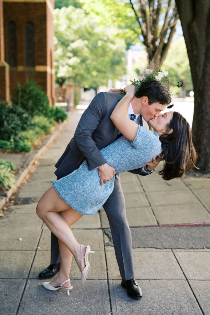 couple dip kiss in the streets during their North Carolina courthouse elopement