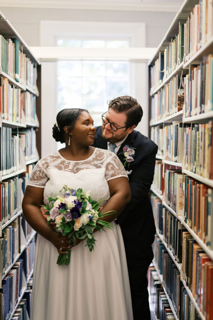 bride and groom at the university library during their north carolina micro wedding