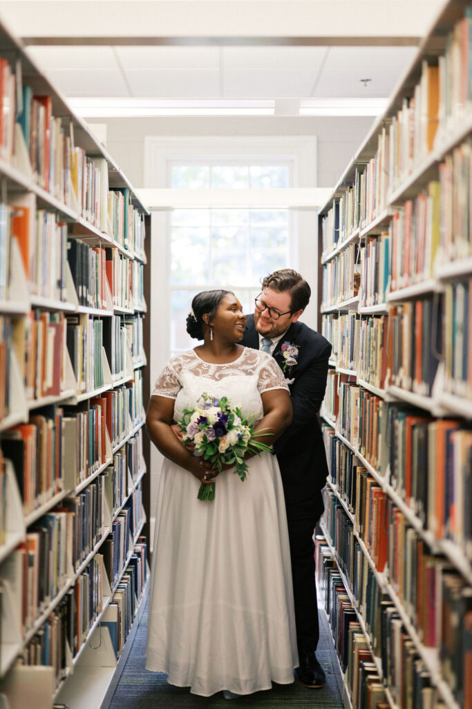 bride and groom at the university library during their north carolina micro wedding