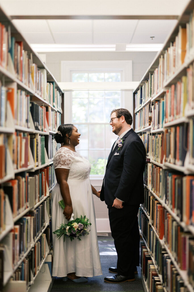 bride and groom at the university library during their north carolina micro wedding