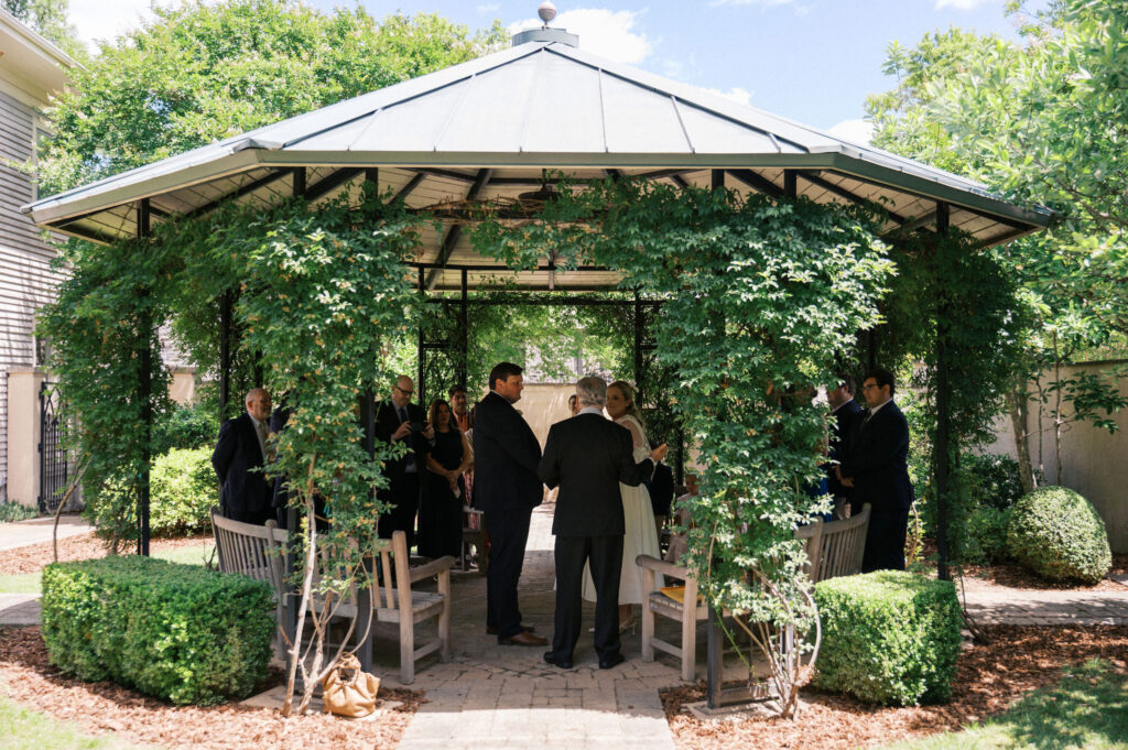 intimate wedding ceremony in a garden during their north carolina micro wedding