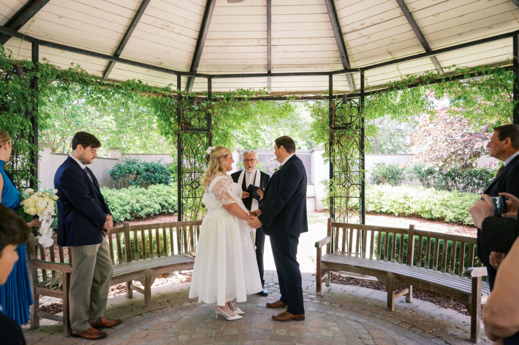 intimate wedding ceremony in a garden during their north carolina micro wedding