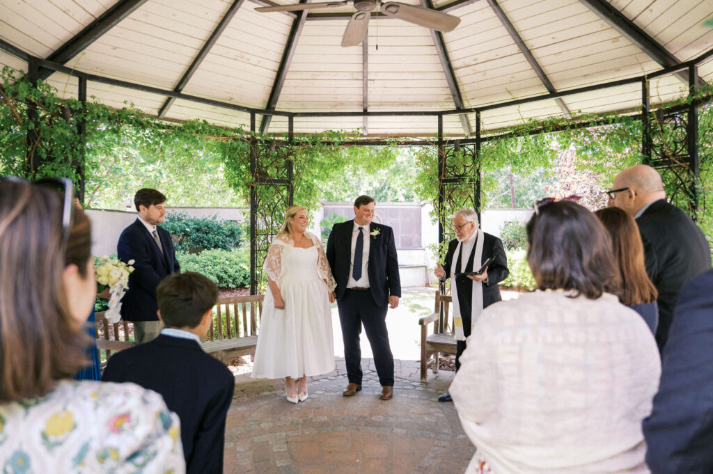 intimate wedding ceremony in a garden during their north carolina micro wedding