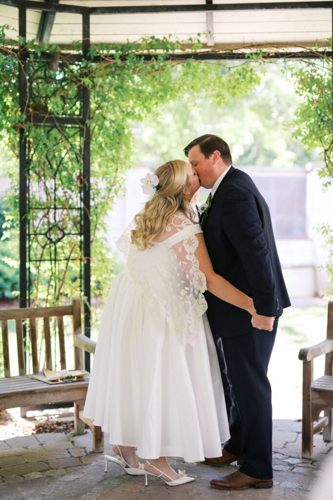 intimate wedding ceremony in a garden during their north carolina micro wedding