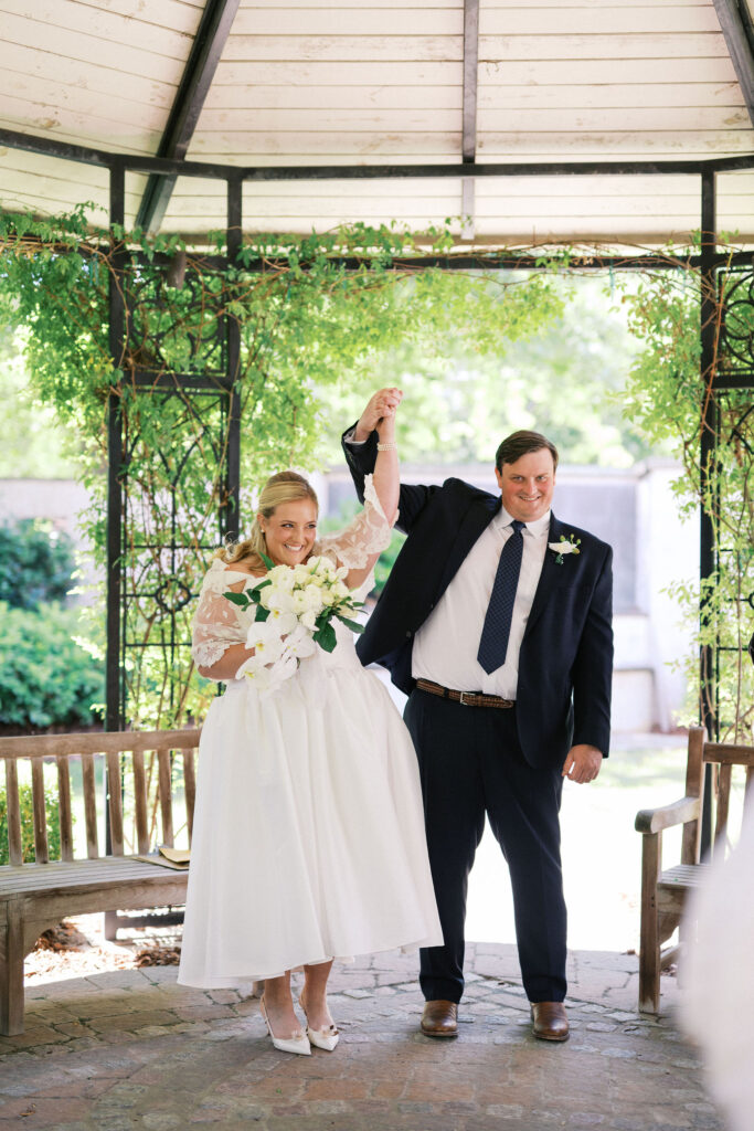 intimate wedding ceremony in a garden during their north carolina micro wedding