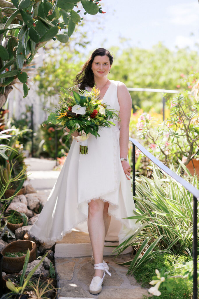 bride and groom first look in a beautiful backyard in the caribbean