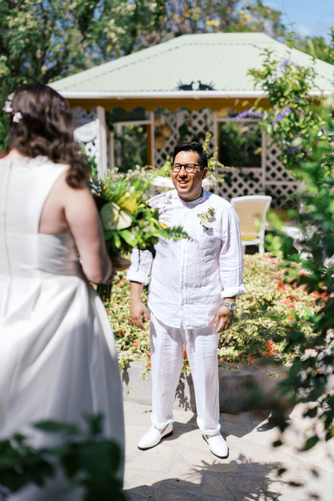 bride and groom first look in a beautiful backyard in the caribbean