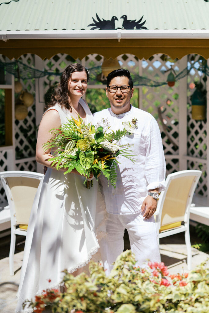 bride and groom first look in a beautiful backyard in the caribbean