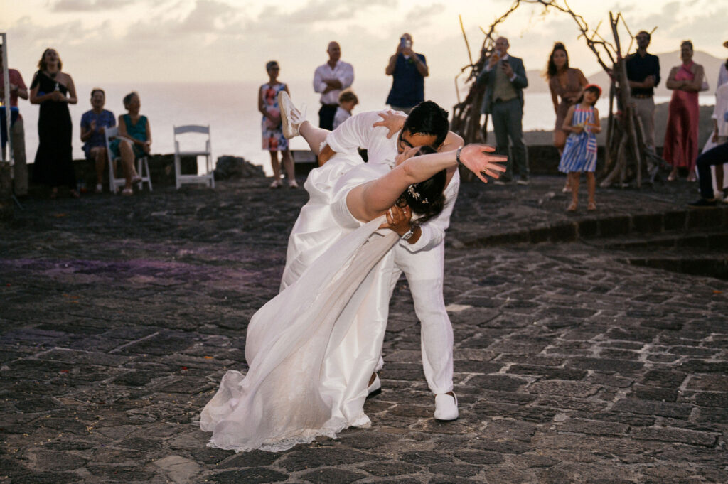 bride and groom dip kiss after first dance