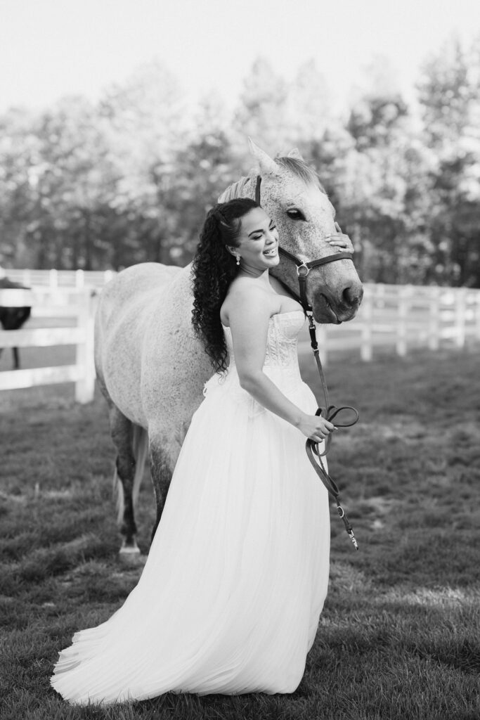bride walking a horse at the greenhouse at arrows farm