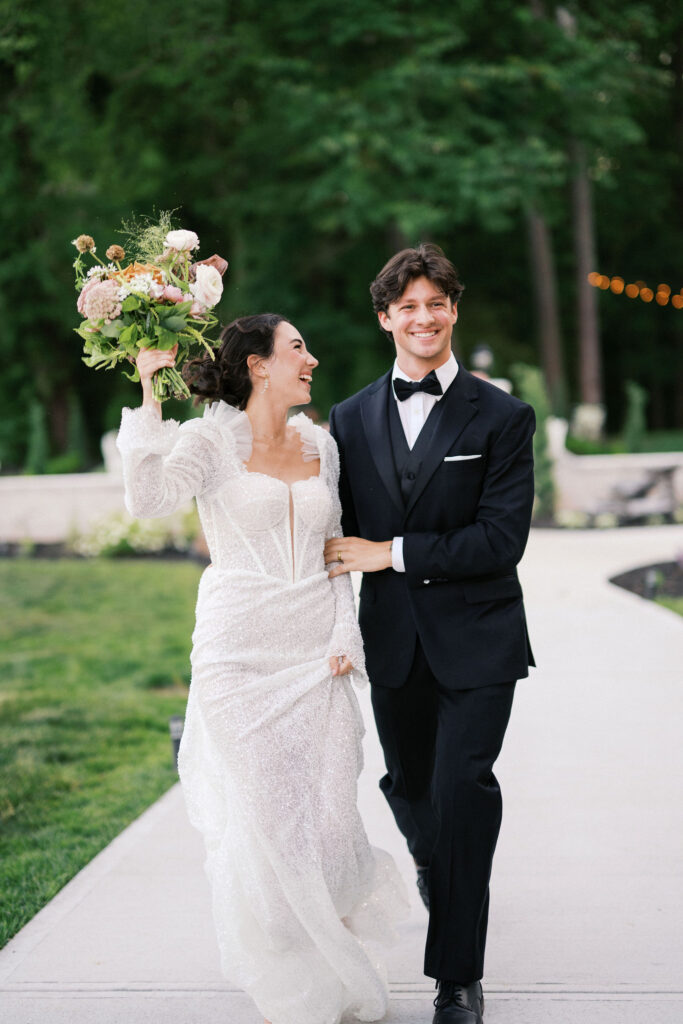 joyful bride and groom at the greenhouse at arrows farm, a nc greenhouse wedding venue