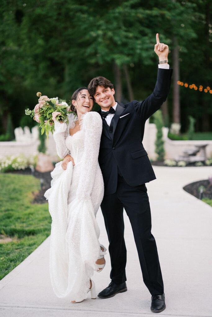 joyful bride and groom at the greenhouse at arrows farm, a nc greenhouse wedding venue