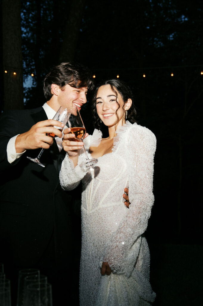 fun and playful moments of bride and groom enjoying champagne